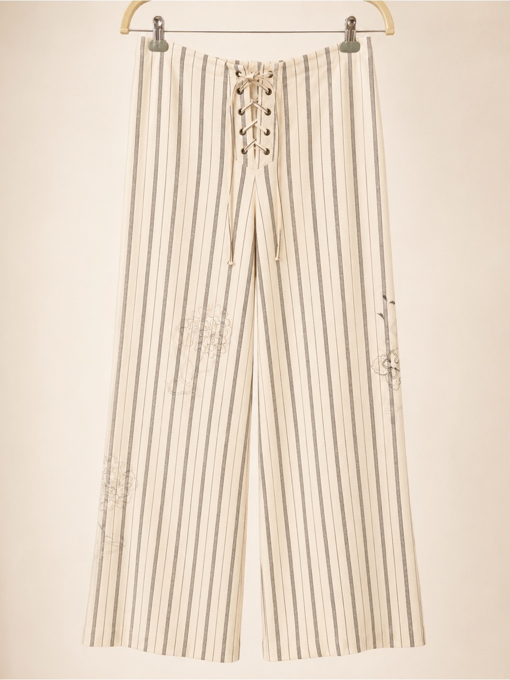 subtle tonal floral embroidery along the legs